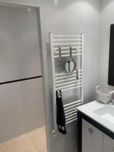 a white bathroom with a shower and a sink at Petite Perle by Port Azur Rental in Cogolin