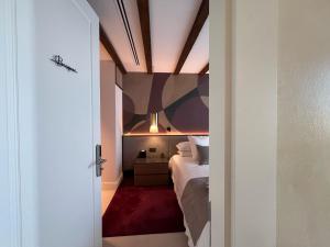 a bedroom with a bed and a ceiling at CasaKary in Seville