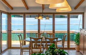 a dining room with a table and chairs at Hotel & Spa Tino Sveti Stefan in Ohrid