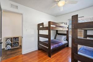 a bedroom with two bunk beds in a room at Curated 2BR/1BA-6 ppl under 1 mile to Downtown in St. Petersburg