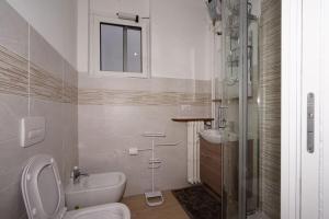 a bathroom with a toilet and a sink at fiordaliso 1 in Milan