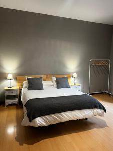 Postel nebo postele na pokoji v ubytování Hostal San Martin