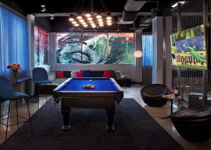 a billiard room with a pool table in it at The Hotel Zags Portland in Portland