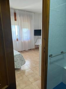 TV a/nebo společenská místnost v ubytování Apartamento LB, vistas a la ría