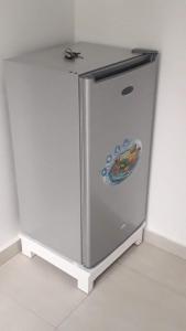 a refrigerator with a sticker on the side of it at Casa Mrichica in Mão para Trás