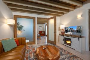 a living room with a couch and a fireplace at Casa Saint Francis- King Bed-Patio & Fire Pit -2BR in Santa Fe