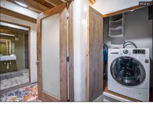 a laundry room with a washing machine in a house at Casa Saint Francis- King Bed-Patio & Fire Pit -2BR in Santa Fe