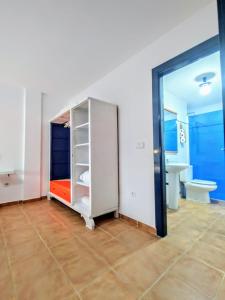 a bathroom with a white cabinet and a sink at Casa Bonica in Palomares