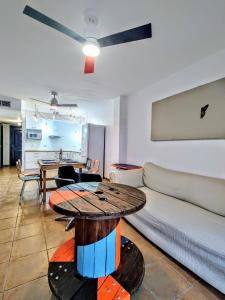 a living room with a table and a couch at Casa Bonica in Palomares