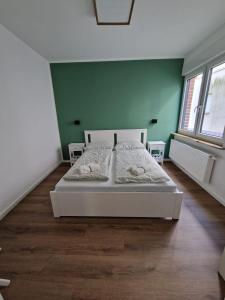 Ένα ή περισσότερα κρεβάτια σε δωμάτιο στο Appartement Am Wald