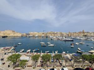 a marina filled with lots of boats in a harbor at KORZO SUITES SENGLEA WATERFRONT in Senglea