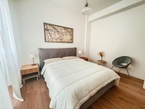 Кровать или кровати в номере ophelia apartment