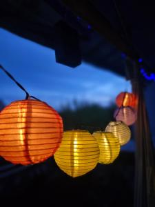 a group of colorful lanterns hanging from a tent at HIGH CLASS - Design Apartment - Favorite Place - Full Equipment - Public Transport in Nuremberg