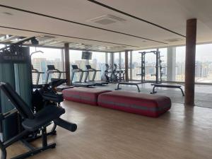 a gym with a row of treadmills and machines at For You Moema 302 Studio da Andrea in São Paulo