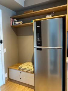 a kitchen with a stainless steel refrigerator in a room at For You Moema 302 Studio da Andrea in São Paulo +26 photos
