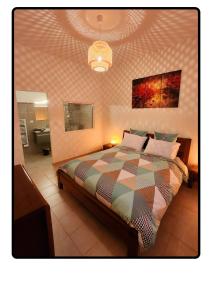 Krevet ili kreveti u jedinici u okviru objekta Appartement Roussillon