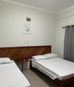 Postel nebo postele na pokoji v ubytování Mariachis Hotel + 34 fotografií