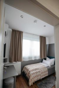 a bedroom with a bed and a large mirror at HoltRock in Oberhausen