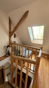 a wooden staircase in a room with a window at Na Piotrowickiej Przełęczy in Bystrzyca Kłodzka