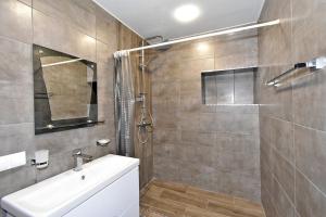 a bathroom with a sink and a shower at Apartment in Zakyan 4 street in Yerevan