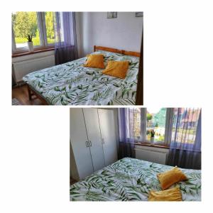 a bedroom with a bed and a window at Apartament Kajki in Mrągowo