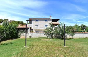 a goal in a field in front of a house at Ferienhaus mit Privatpool für 8 Personen ca 135 qm in Pula, Istrien Istrische Riviera in Pula