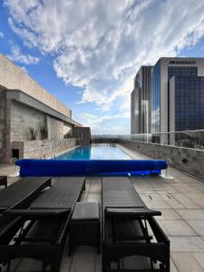 a swimming pool on the roof of a building at Melodious homes elite residency in Nairobi