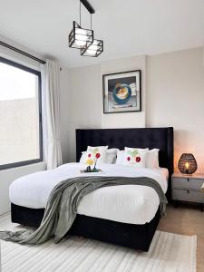 Кровать или кровати в номере Melodious homes elite residency