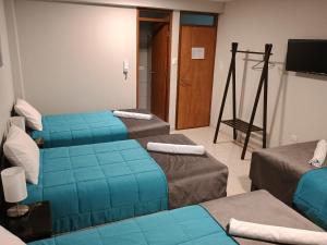 Voodi või voodid majutusasutuse Vianca Hotel toas