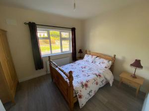 Postel nebo postele na pokoji v ubytování O'Carolan Lodge