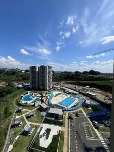 an aerial view of a resort with two pools at Luxurious With Private Jacuzzi 3-Bedroom Apartment in Pereira in San Joaquín