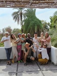 a group of people posing for a picture at ABU Guest House in Aswan