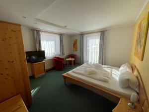 Posteľ alebo postele v izbe v ubytovaní Hotel Garni Burger