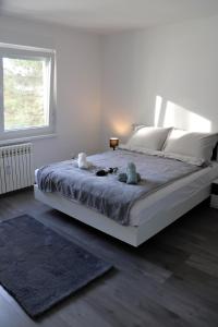 Postel nebo postele na pokoji v ubytování Apartman Callosum + 21 fotografií