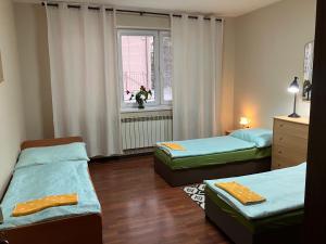 a room with two beds and a window at Kosice in Košice