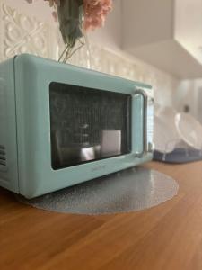 a toaster oven sitting on top of a table at MG Luxury Home in Naples