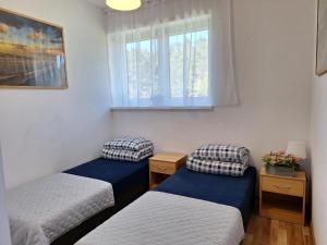 Leśne Zacisze客房内的一张或多张床位