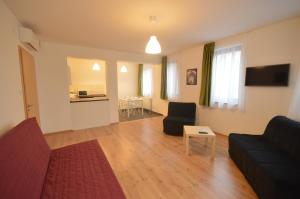 TV a/nebo společenská místnost v ubytování Toldi Apartments Pécs