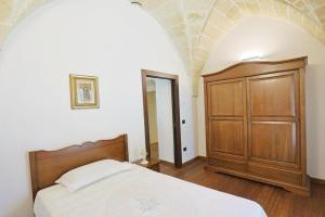 Postel nebo postele na pokoji v ubytování villa dei cento Pini