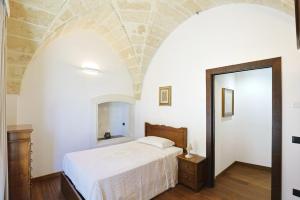 Postel nebo postele na pokoji v ubytování villa dei cento Pini