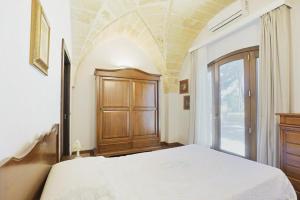 Postel nebo postele na pokoji v ubytování villa dei cento Pini