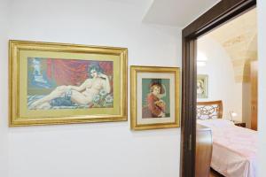 Postel nebo postele na pokoji v ubytování villa dei cento Pini