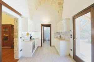 Kuchyň nebo kuchyňský kout v ubytování villa dei cento Pini