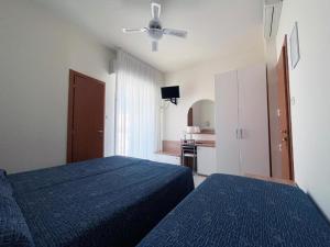 Postel nebo postele na pokoji v ubytování Hotel Majestic