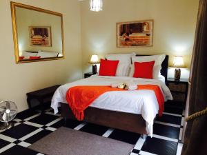Ένα ή περισσότερα κρεβάτια σε δωμάτιο στο Helderberg Guesthouse
