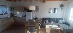 a living room with a couch and a table at Diament Rogowo in Rogowo