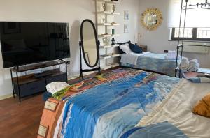 a bedroom with a large bed and a large mirror at Capri Sky Loft in Boscoreale +102 photos