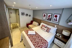 A bed or beds in a room at Flat Completo Granja Brasil