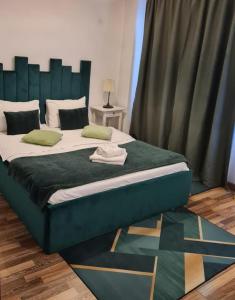 En eller flere senge i et værelse på Apartament Fundeni