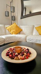 a plate of food on a table in a living room at StayViva - Spacoius 3 BR House - Garden, Games Room, Parking near Town Centre and Train station in Bracknell